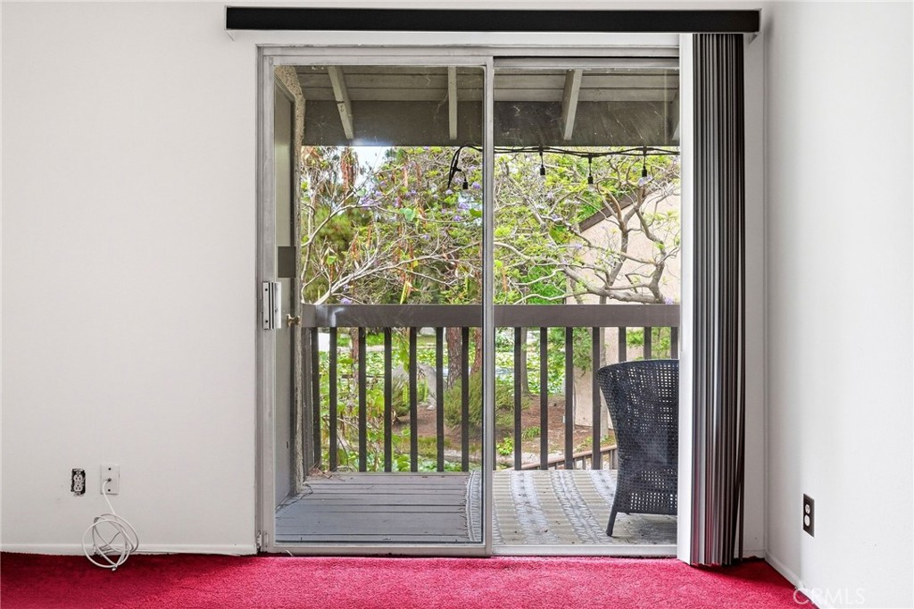 7890 East Spring Street, Unit 11E Long Beach, CA 90815 - Photo 27 of 40 a view of a door and a window