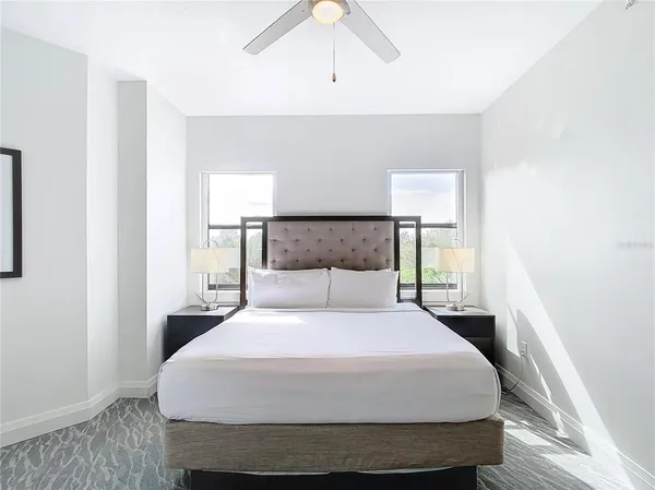 a bedroom with a bed and a dresser