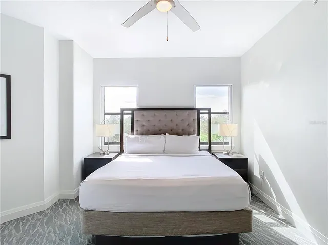 a bedroom with a bed and a dresser