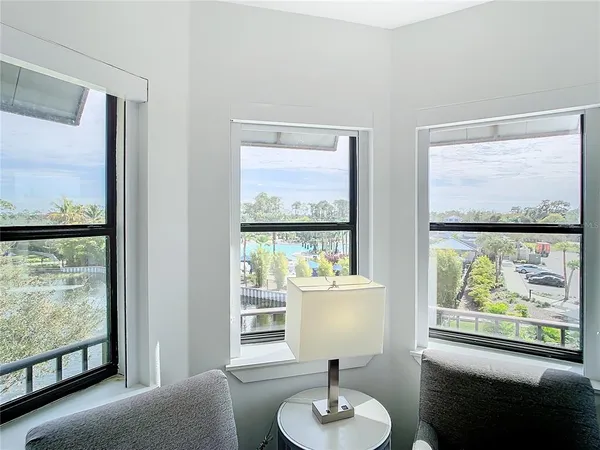 a bathroom with a granite countertop shower sink and toilet