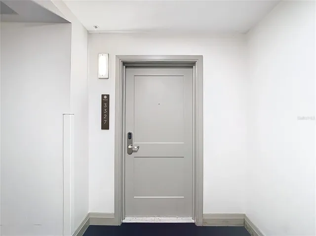 a view of hallway with wooden floor