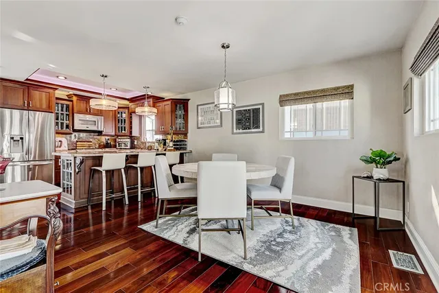 a living room with furniture a rug and a chandelier
