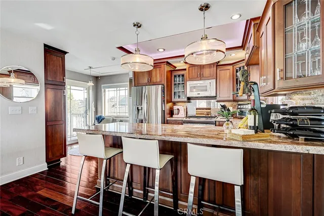 a large kitchen with a table and chairs