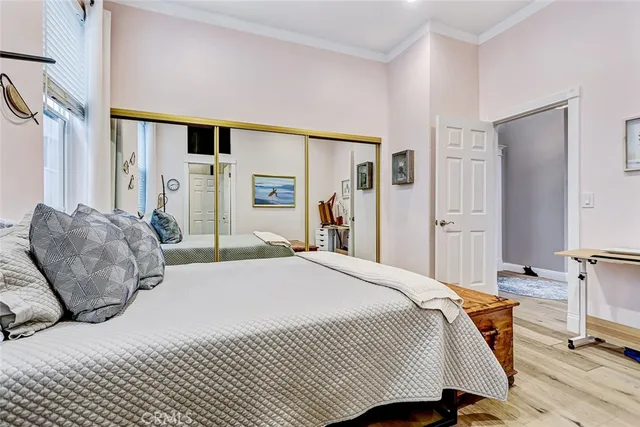 a bedroom with a bed and a dresser