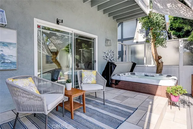a outdoor space with patio the couches and a potted plant on coffee table with outer view
