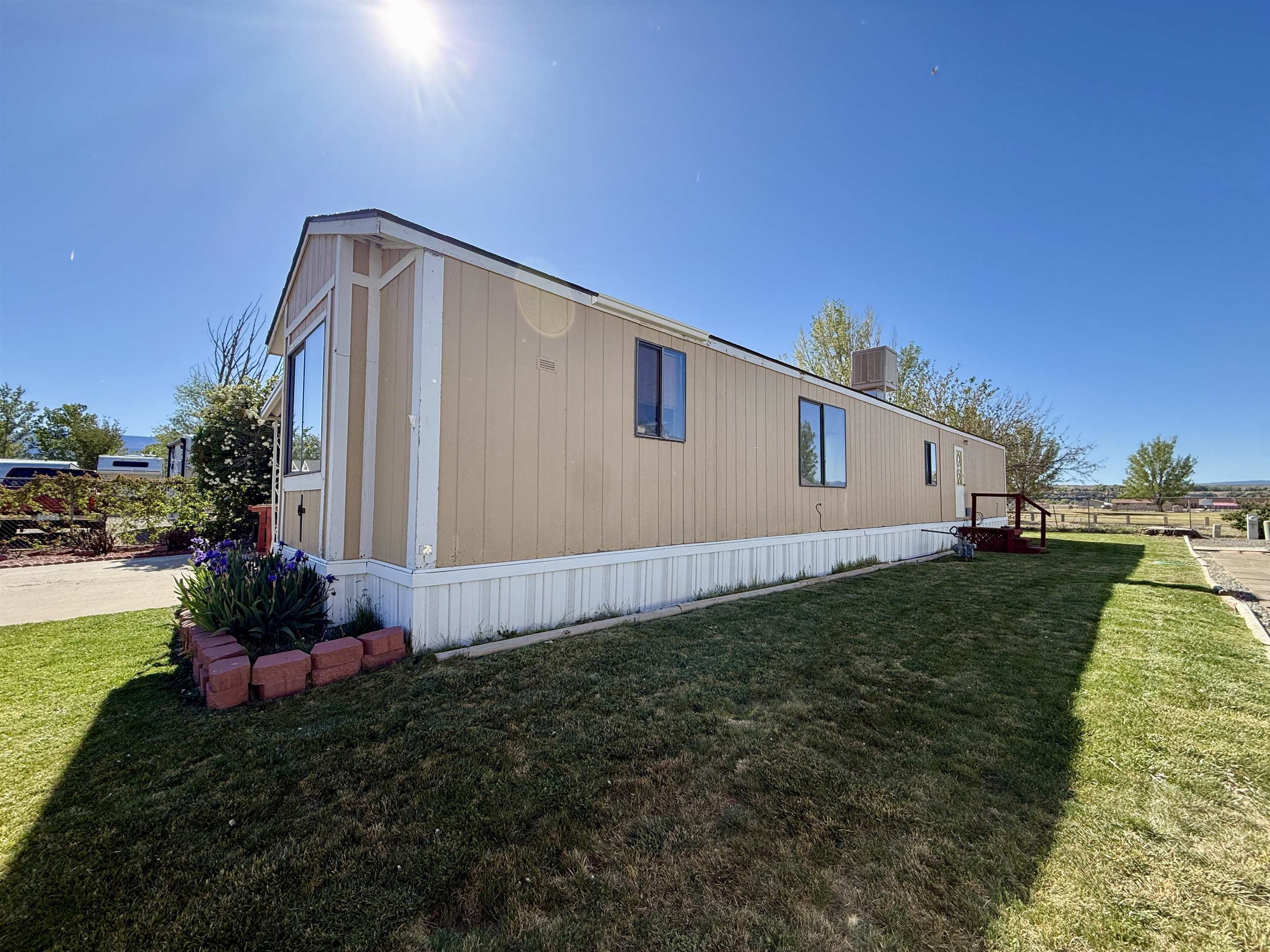 3251 E Road, Unit 33 Clifton, CO 81520 - Photo 28 of 28 a house view with a backyard space