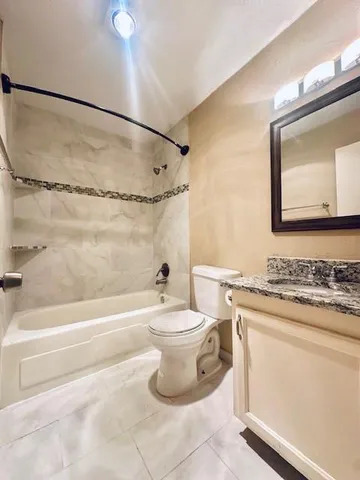 a bathroom with a sink a toilet and a bathtub