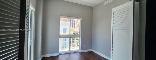 a view of front door with wooden floor