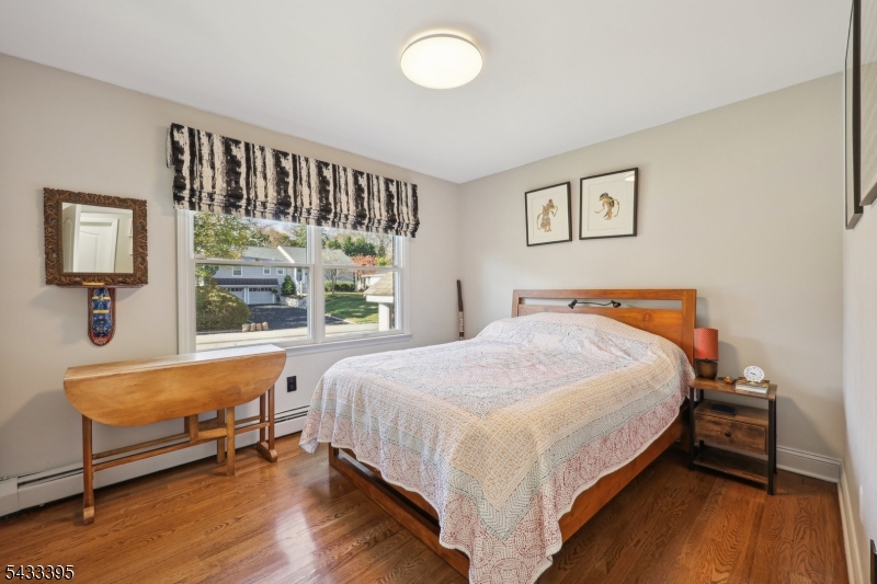 48 Woodmont Road Montclair, NJ 07043 - Photo 11 of 20 a bed sitting in a bedroom next to a window