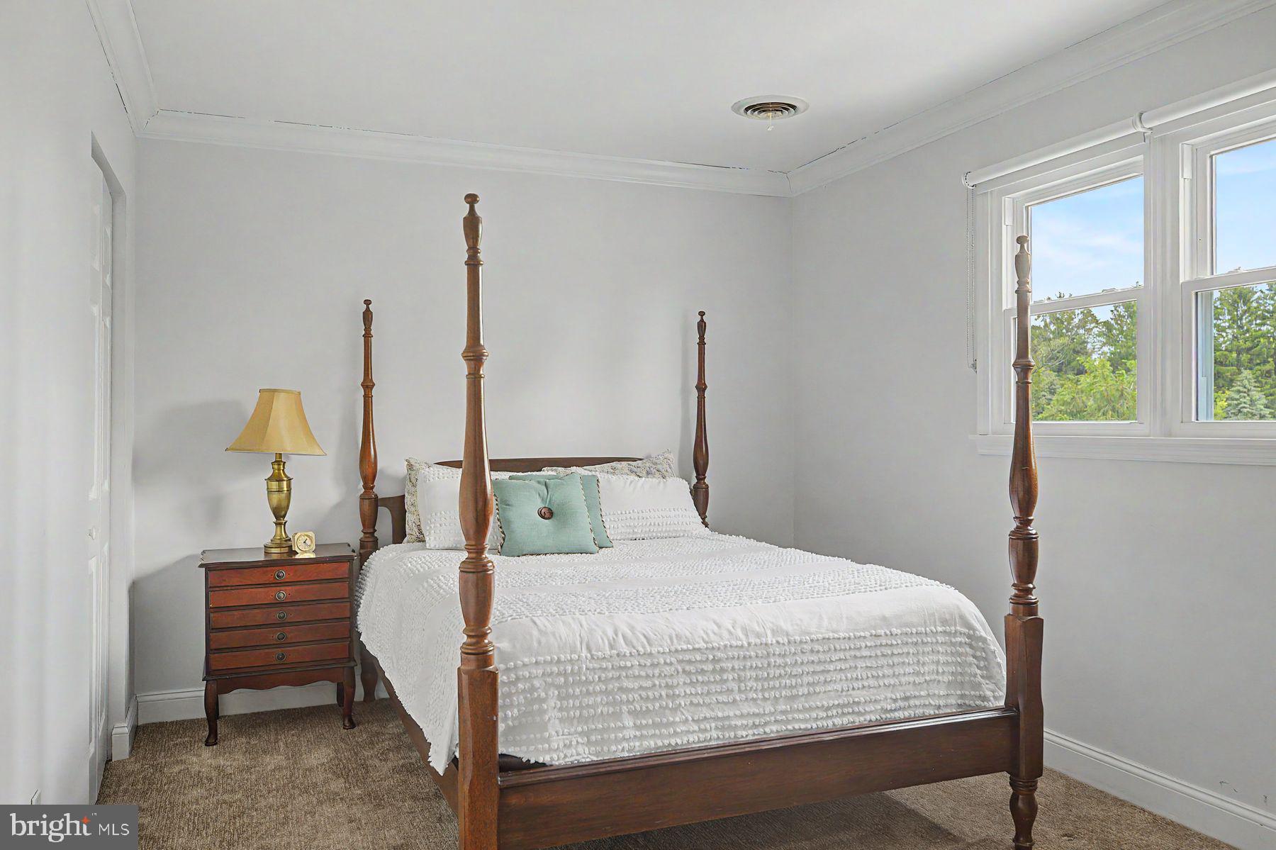 4009 Smoke Road Doylestown, PA 18902 - Photo 40 of 52 a bedroom with a bed wooden floor and window