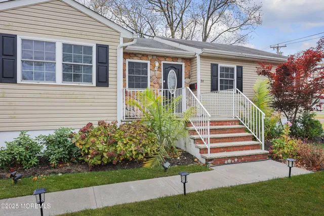 a front view of a house with a yard