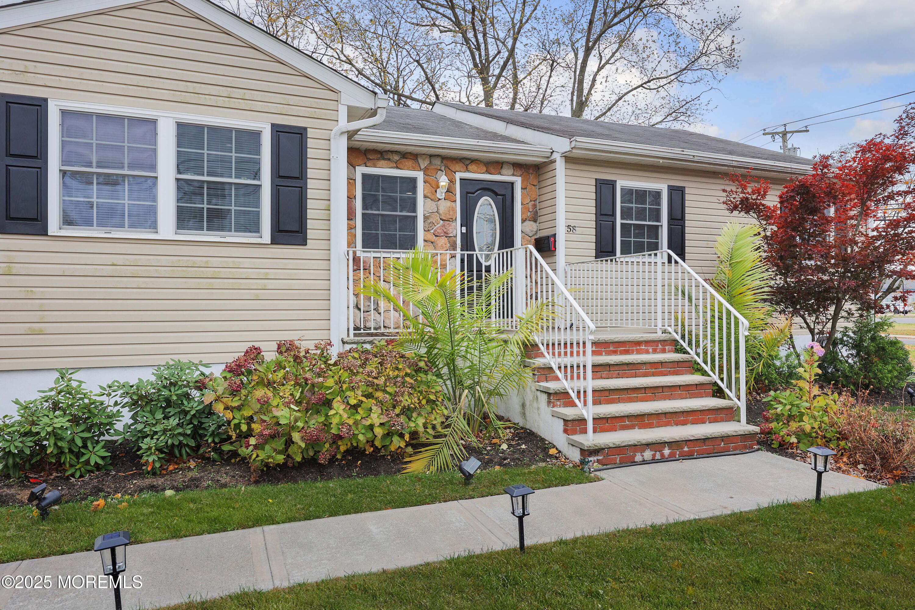 58 Richardson Avenue Eatontown, NJ 07724 - Photo 1 of 26 a front view of a house with a yard