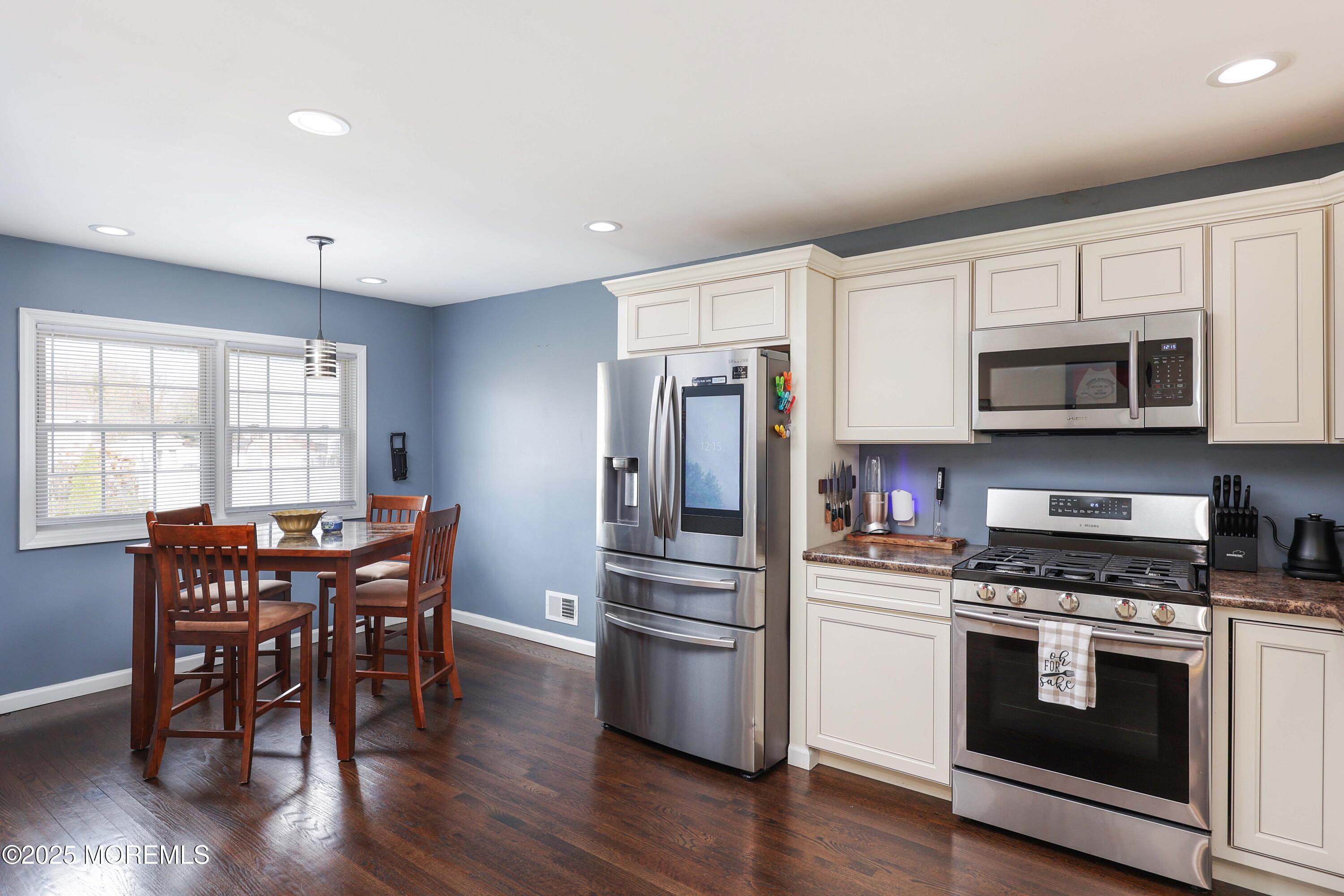 58 Richardson Avenue Eatontown, NJ 07724 - Photo 11 of 26 a kitchen with granite countertop stainless steel appliances a dining table and chairs
