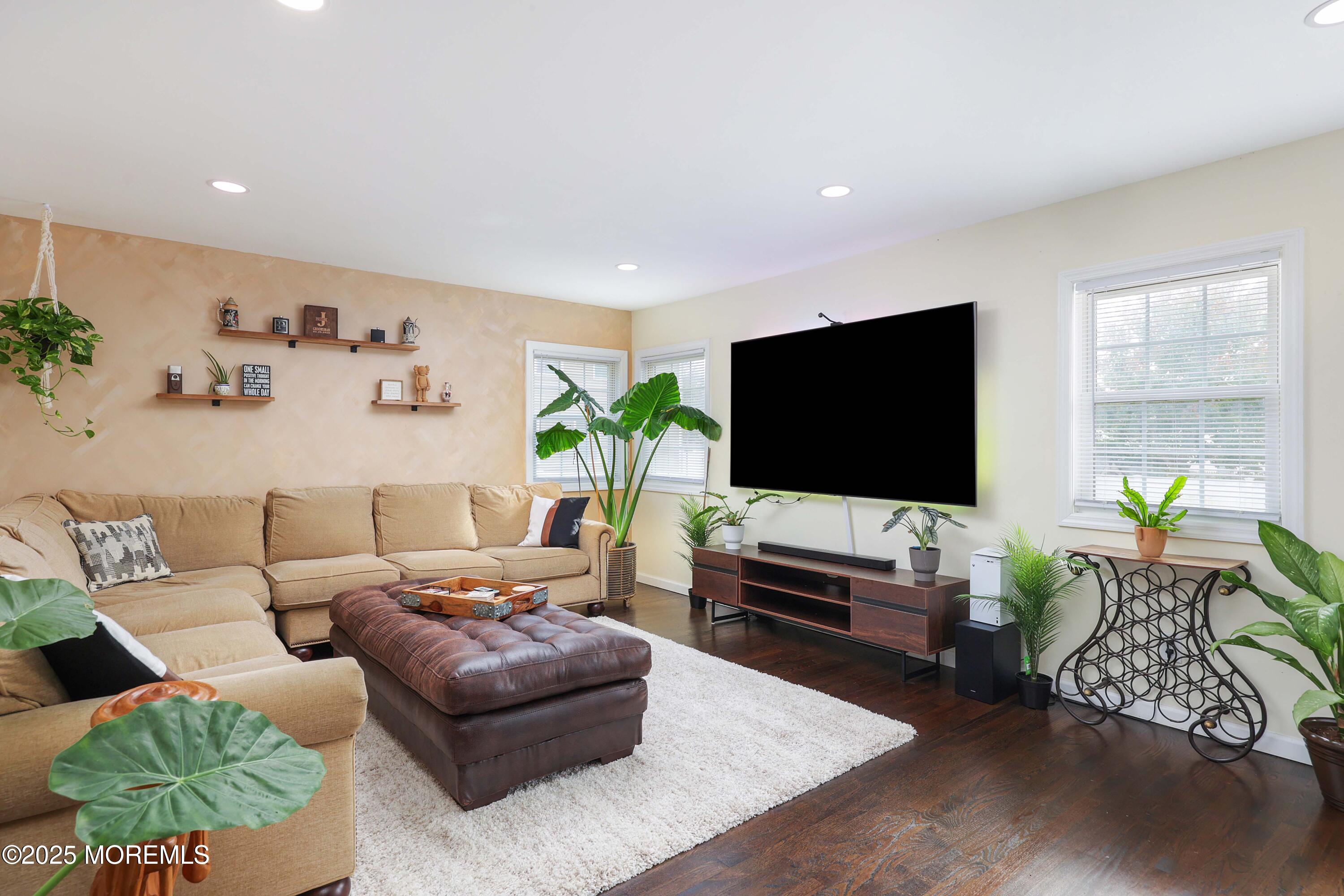 58 Richardson Avenue Eatontown, NJ 07724 - Photo 13 of 26 a living room with furniture and a flat screen tv