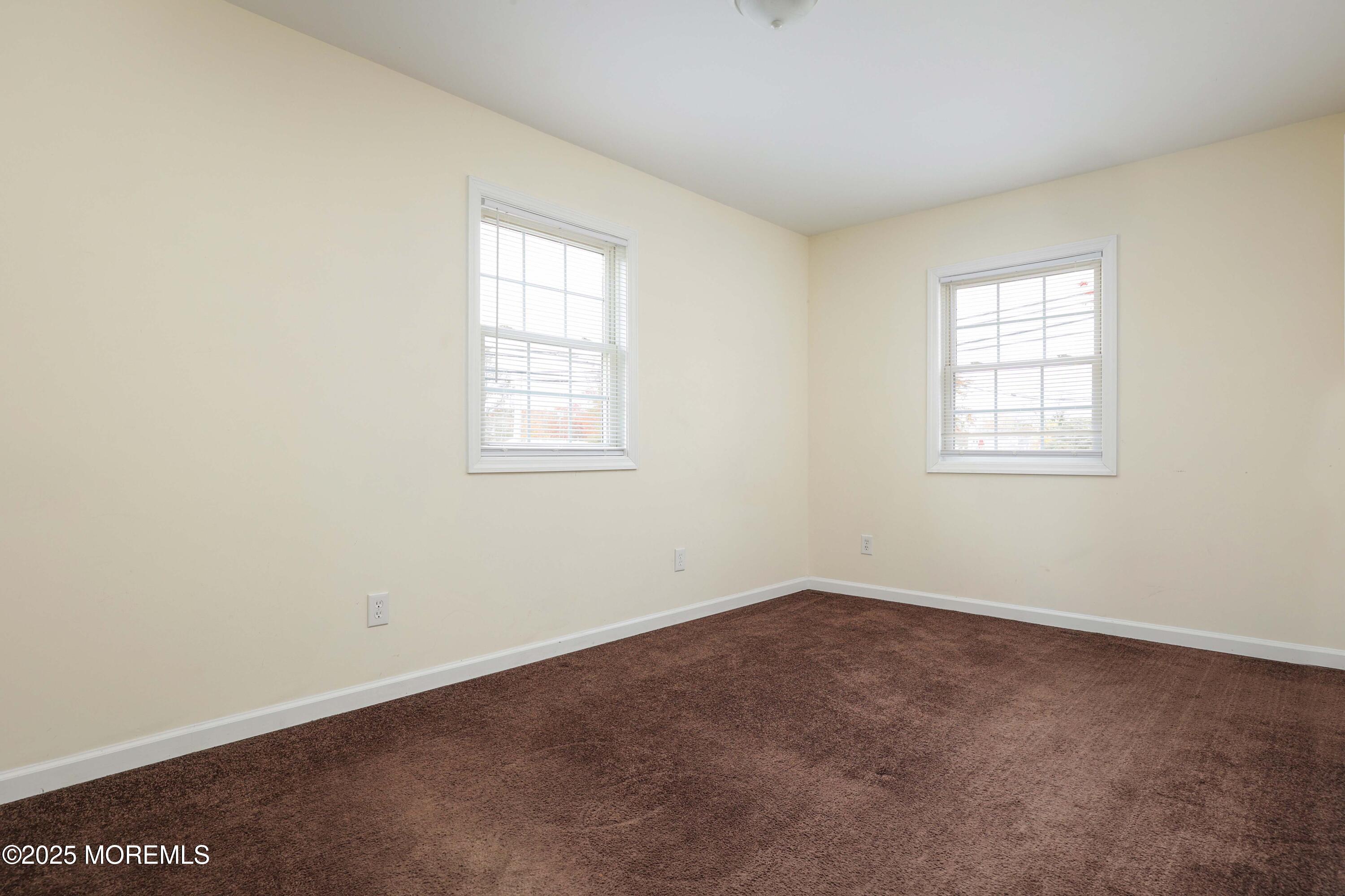 58 Richardson Avenue Eatontown, NJ 07724 - Photo 16 of 26 an empty room with windows