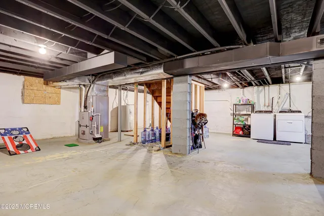 a view of storage and utility room with washer and dryer