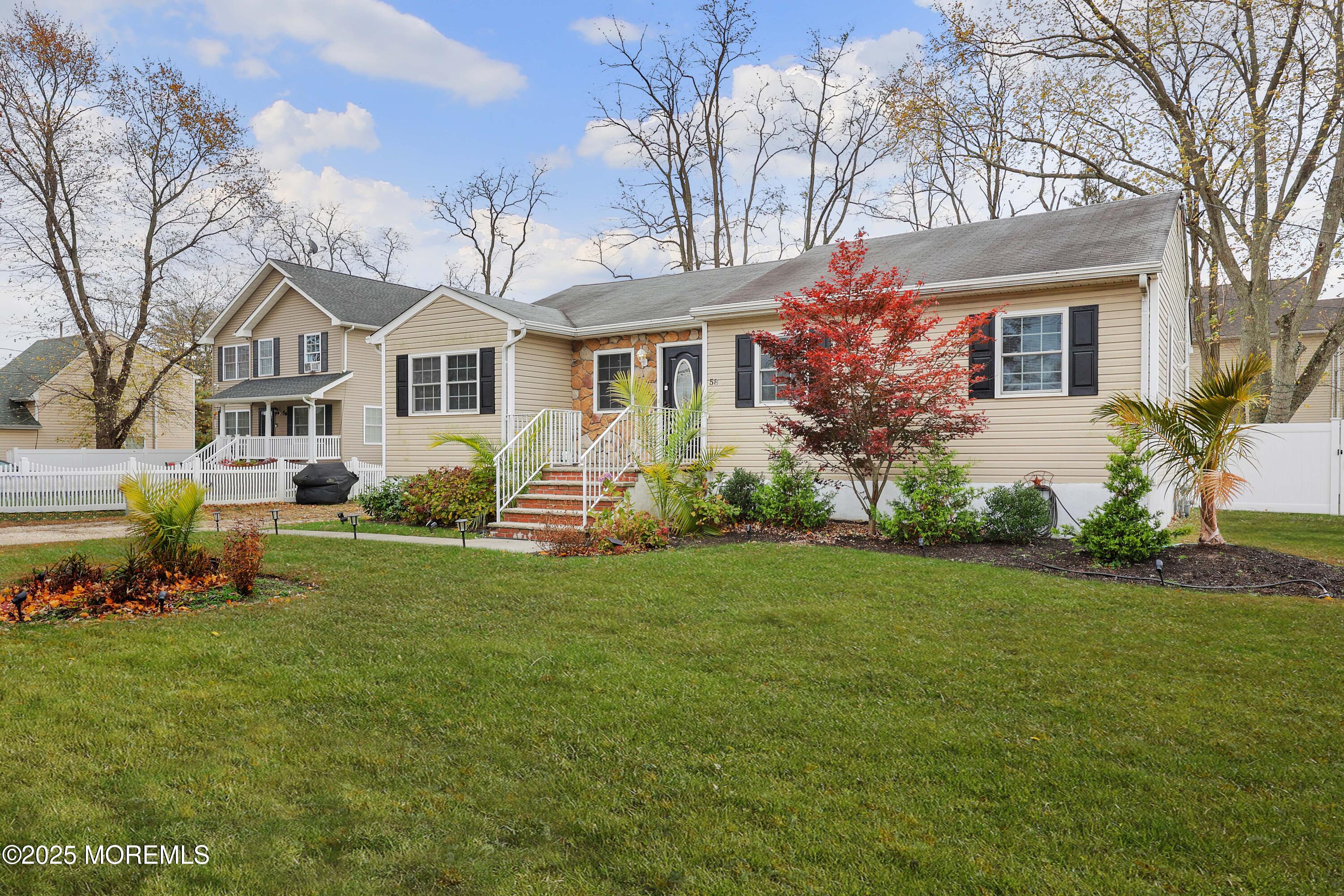 58 Richardson Avenue Eatontown, NJ 07724 - Photo 2 of 26 a front view of house with yard and green space