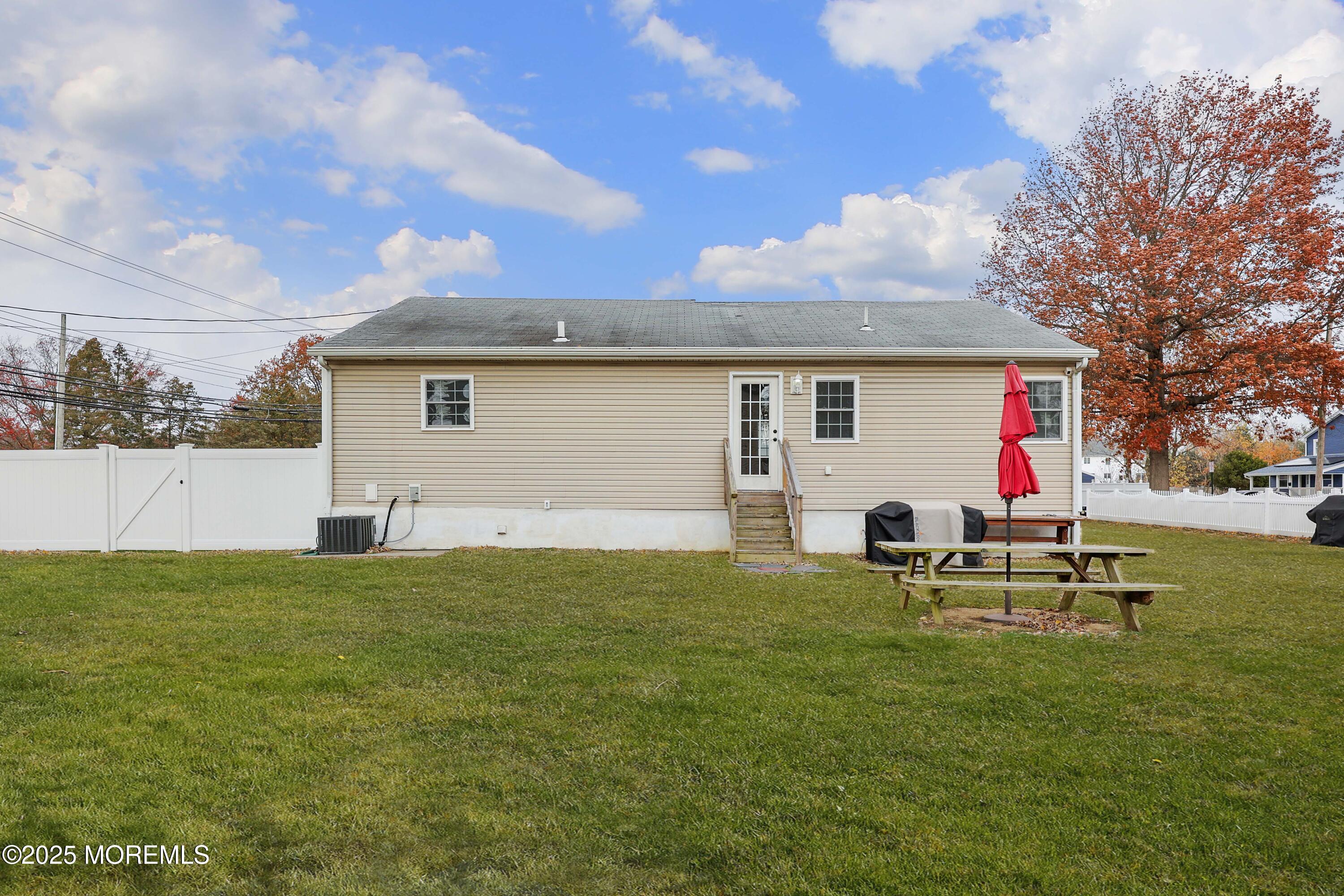 58 Richardson Avenue Eatontown, NJ 07724 - Photo 24 of 26 a backyard of a house with table and chairs