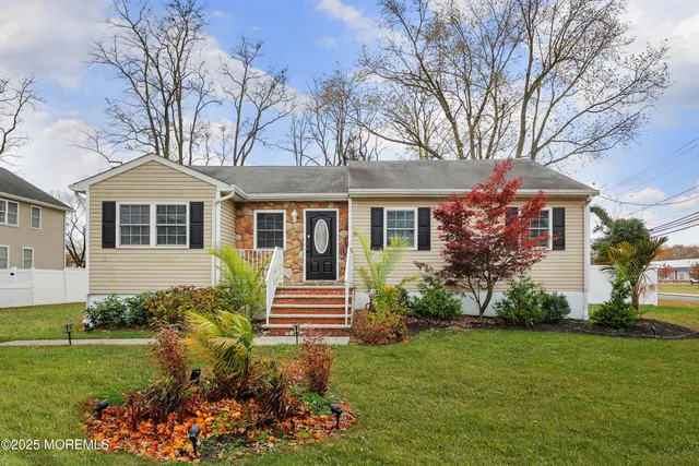 a front view of a house with a garden