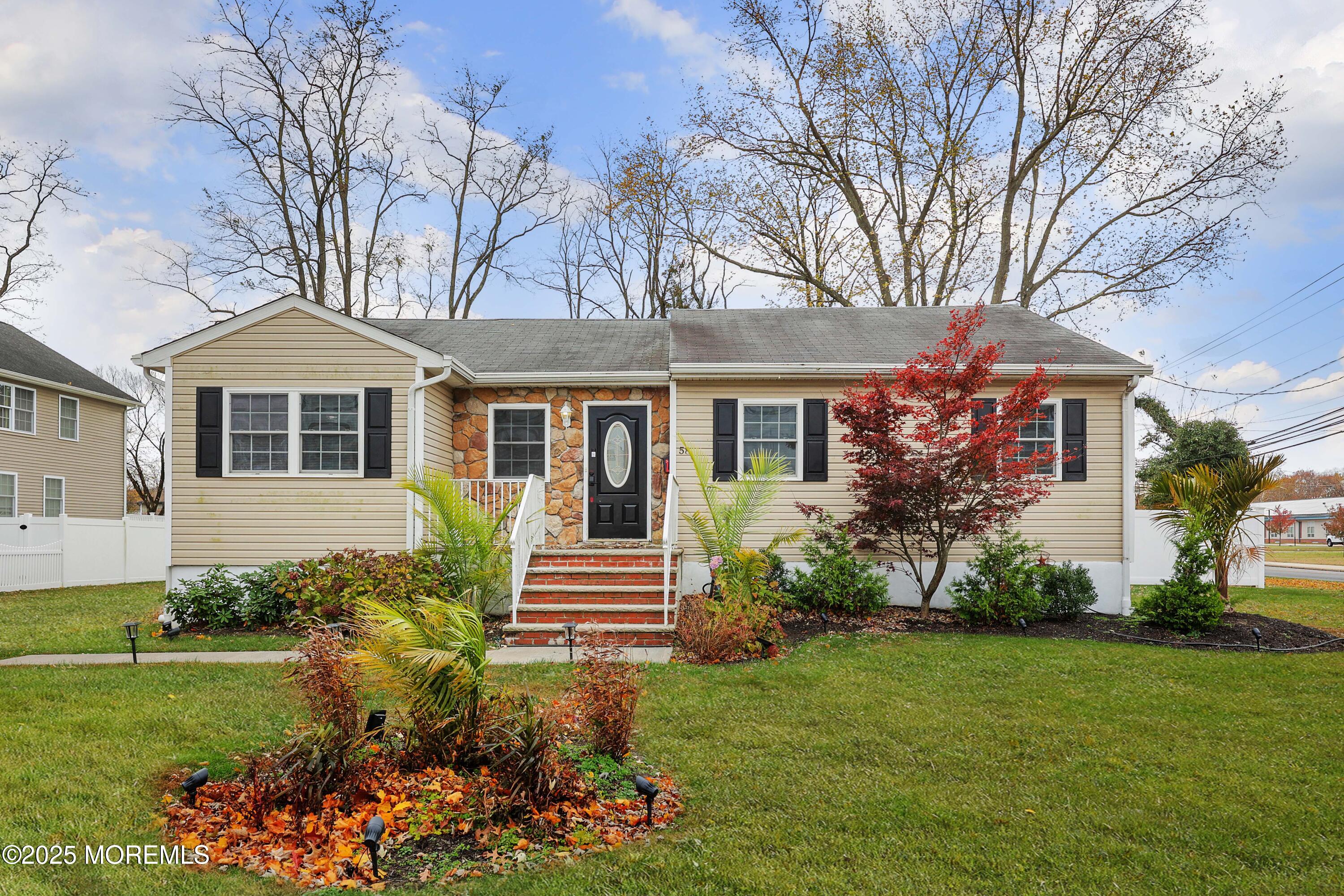 58 Richardson Avenue Eatontown, NJ 07724 - Photo 3 of 26 a front view of a house with a garden
