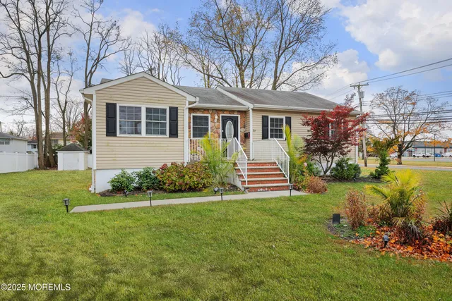 a front view of a house with a yard