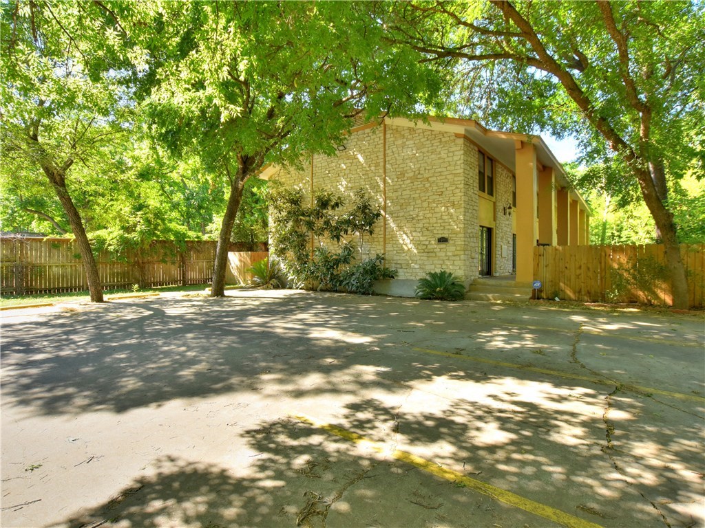 a view of a house with a tree