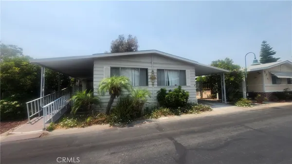a front view of a house with yard