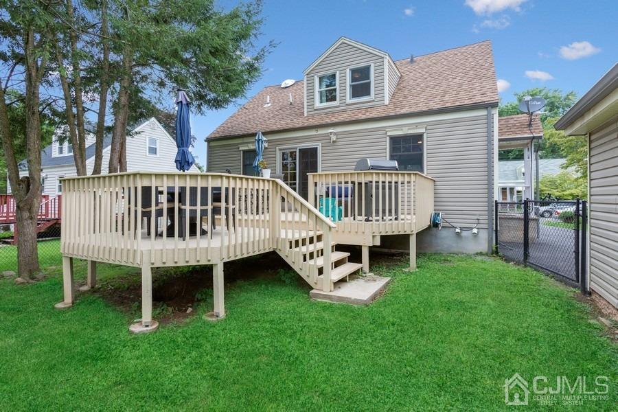 817 Dunellen Avenue Dunellen, NJ 08812 - Photo 17 of 20 a view of a house with a yard and deck