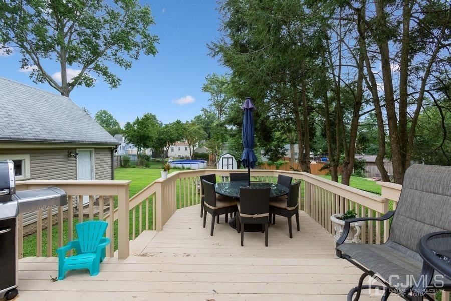 817 Dunellen Avenue Dunellen, NJ 08812 - Photo 18 of 20 a view of a patio with a table and chairs