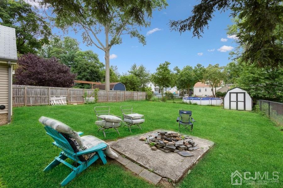 817 Dunellen Avenue Dunellen, NJ 08812 - Photo 19 of 20 a view of a table and chairs in the garden