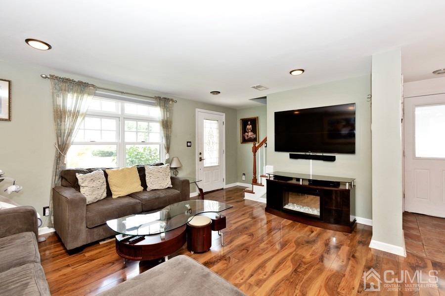 817 Dunellen Avenue Dunellen, NJ 08812 - Photo 5 of 20 a living room with furniture and a flat screen tv