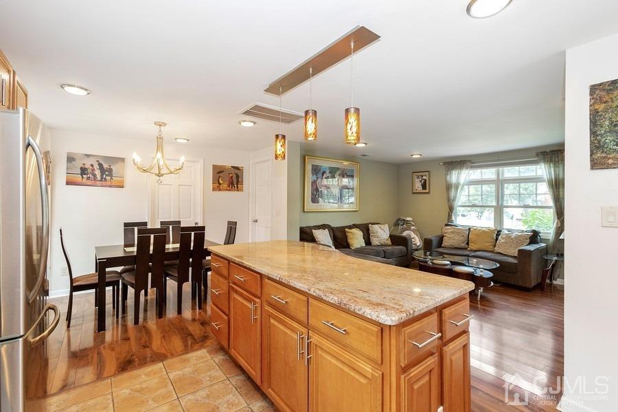 817 Dunellen Avenue Dunellen, NJ 08812 - Photo 8 of 20 a kitchen with granite countertop a sink a counter top space and stainless steel appliances