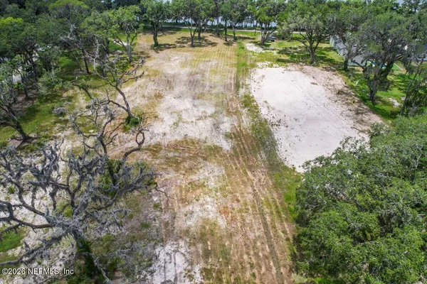 a view of a lake with a yard