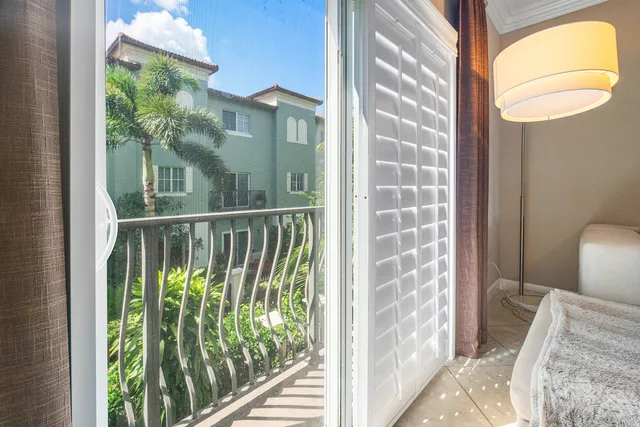 a living room with furniture and painting on the wall
