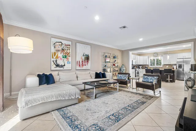 a bedroom with a bed and glass windows