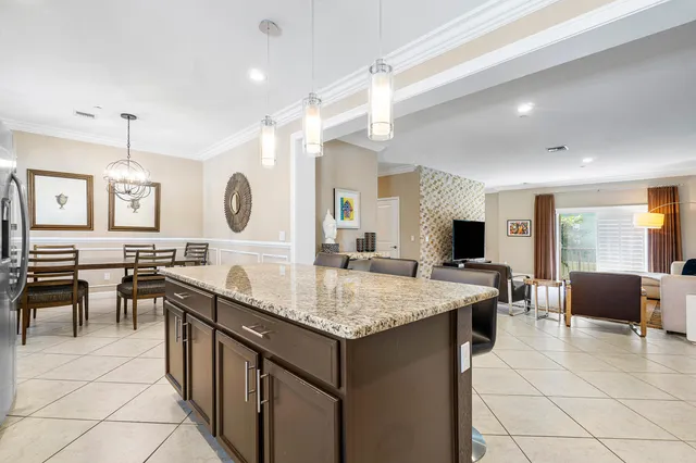 a view of a dining room with furniture and window