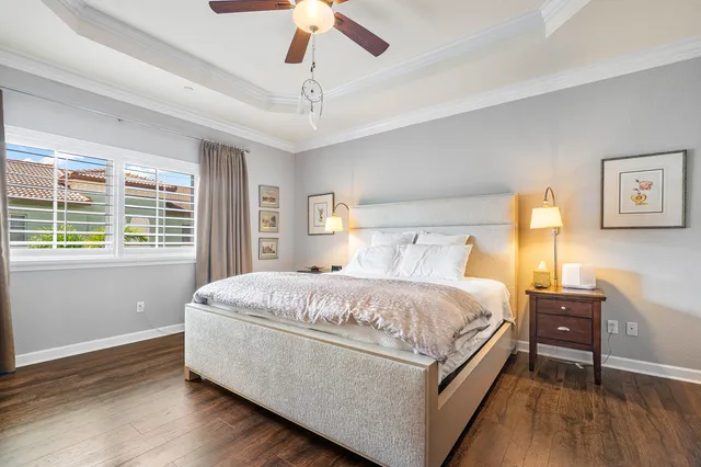 a bed room with a bed and a chandelier