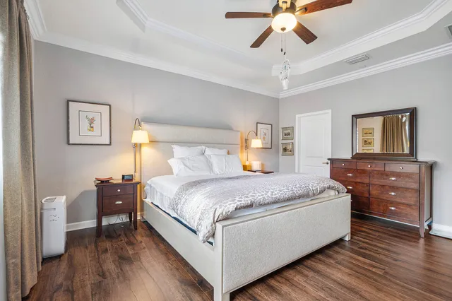 a bathroom with a double vanity sink a mirror and a bathtub