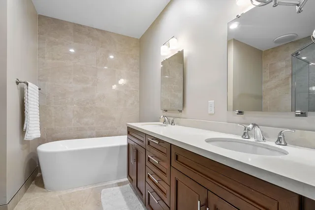 a bathroom with a toilet a sink and shower