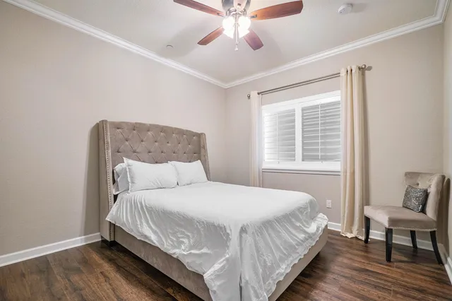 a view of a chair and table in backyard of the house
