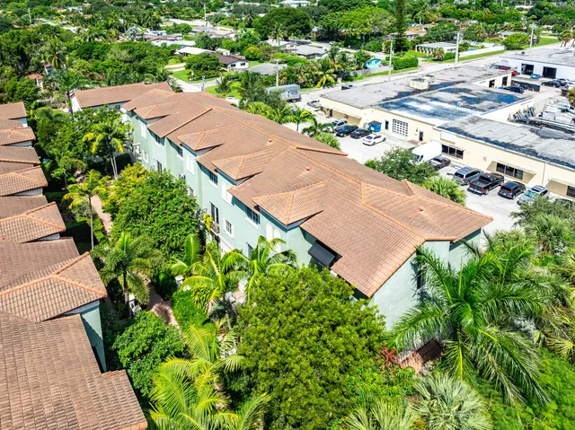 an aerial view of residential houses with outdoor space