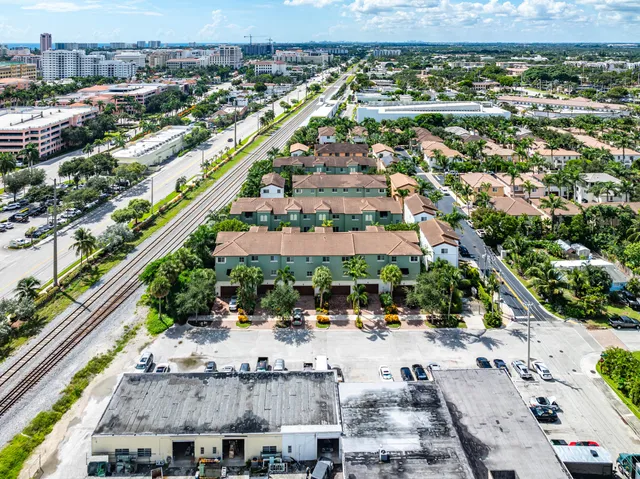 an aerial view of residential houses with outdoor space