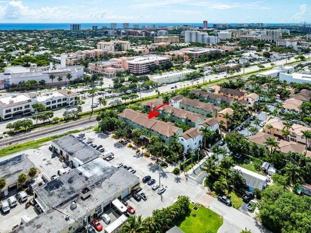 an aerial view of residential houses with outdoor space