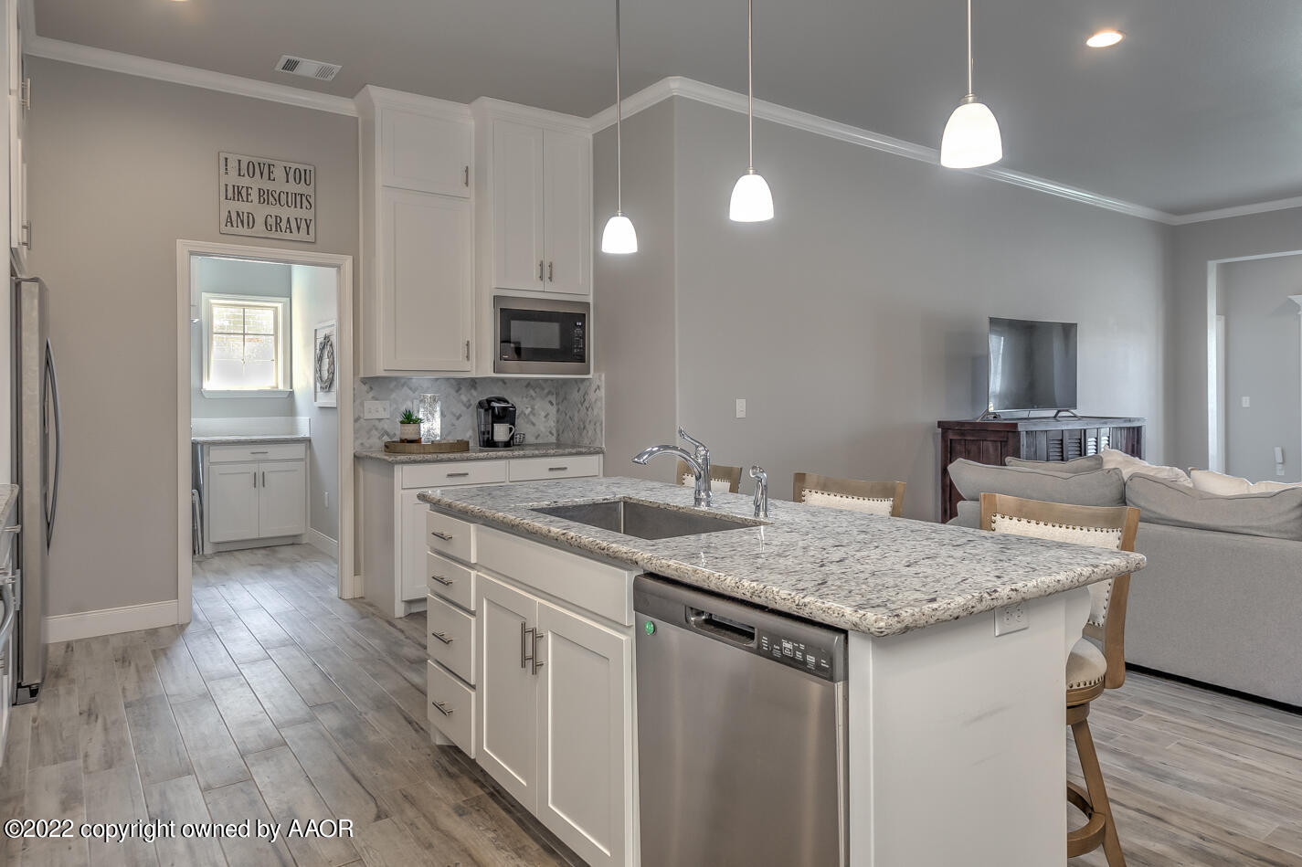6103 Bowery Amarillo, TX 79119 - Photo 11 of 23 a kitchen with a sink stove and cabinets