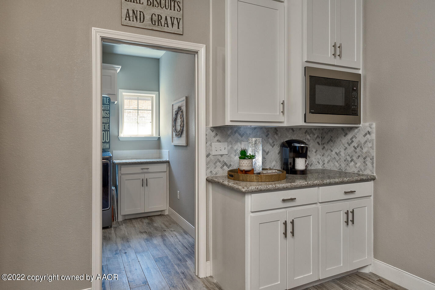 6103 Bowery Amarillo, TX 79119 - Photo 12 of 23 a kitchen with white cabinets and sink