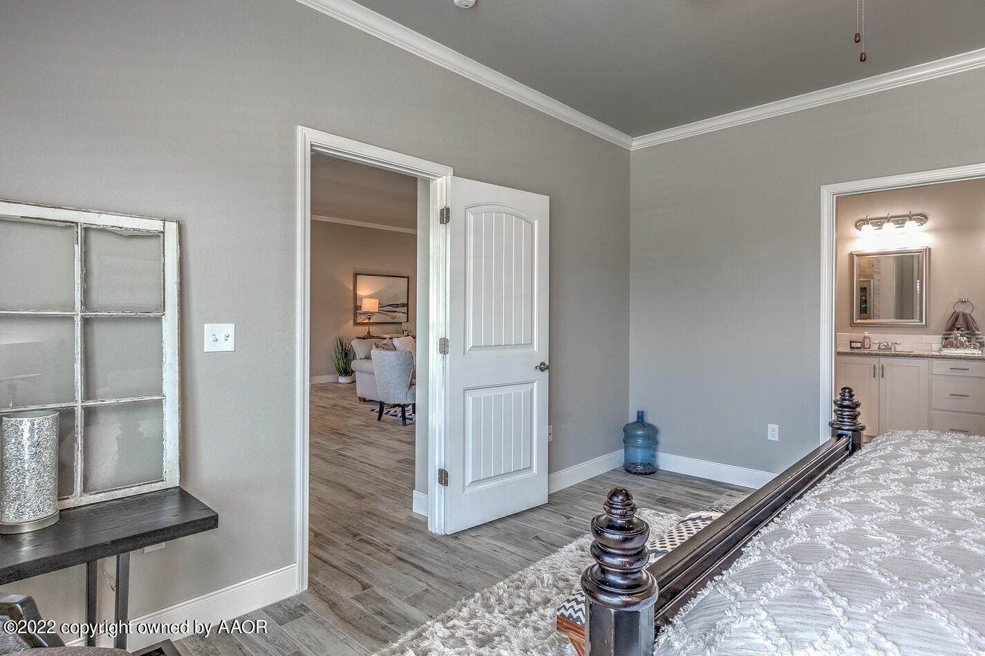 6103 Bowery Amarillo, TX 79119 - Photo 14 of 23 a very nice looking room with a wooden floor and a bathroom