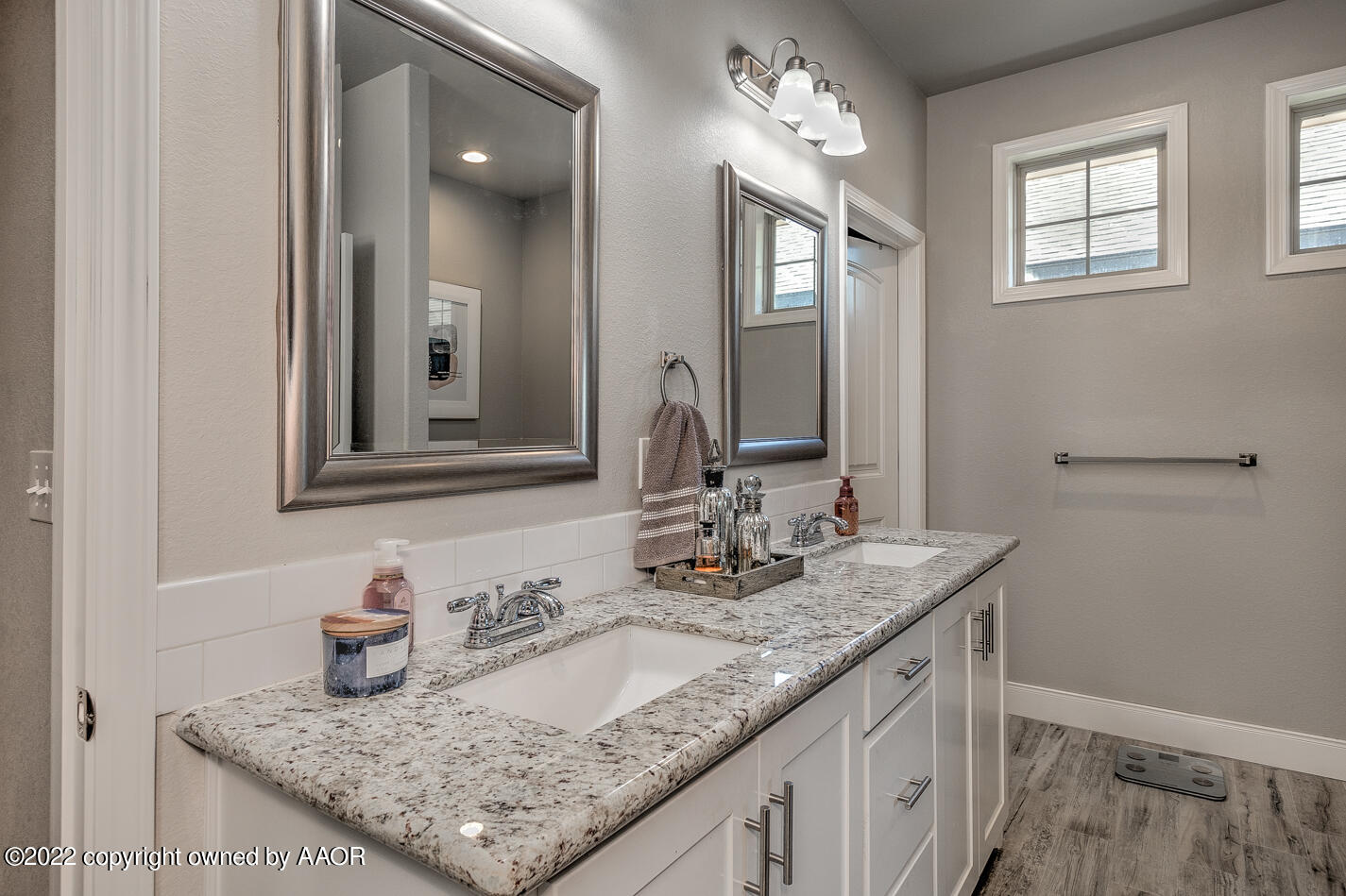 6103 Bowery Amarillo, TX 79119 - Photo 15 of 23 a bathroom with a granite countertop sink and a mirror