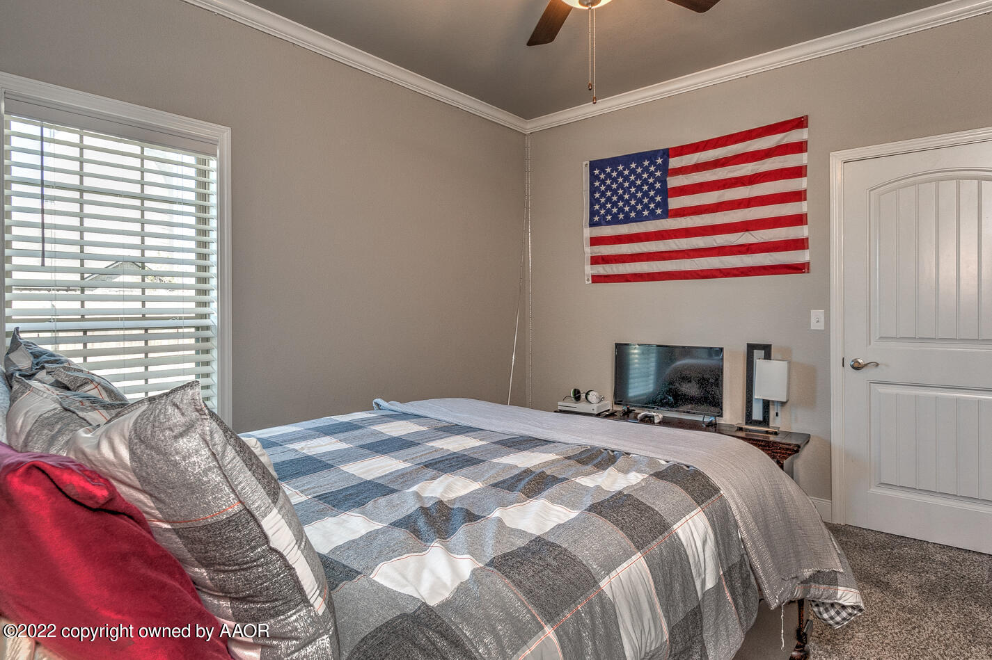 6103 Bowery Amarillo, TX 79119 - Photo 17 of 23 a bedroom with a bed and a fireplace