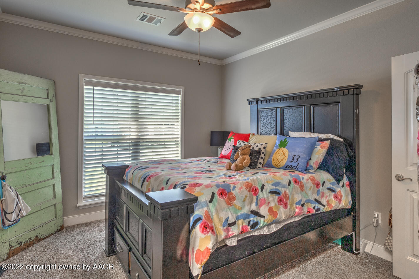 6103 Bowery Amarillo, TX 79119 - Photo 20 of 23 a bedroom with a bed and a chandelier