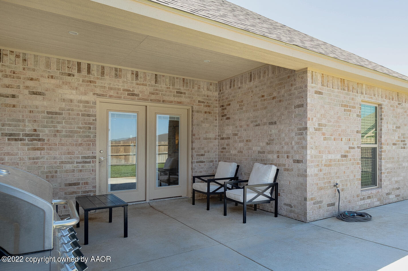 6103 Bowery Amarillo, TX 79119 - Photo 22 of 23 a view of a patio with table and chairs and wooden floor
